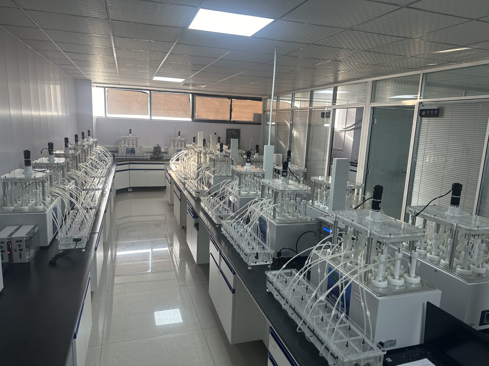 A laboratory fitted with rows of Anaero BMP test systems