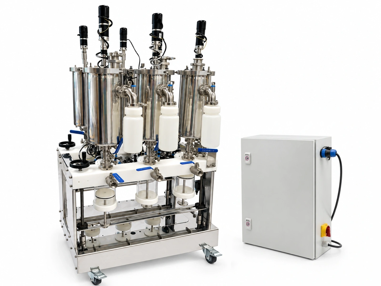 The Lobster auto-fed digester on its wheeled stainless frame beside the PLC control cabinet